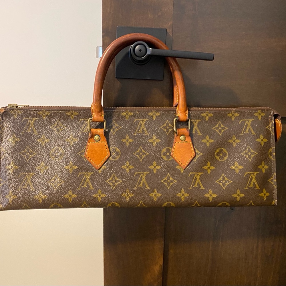 Louis Vuitton Monogram Sac Triangle Handbag